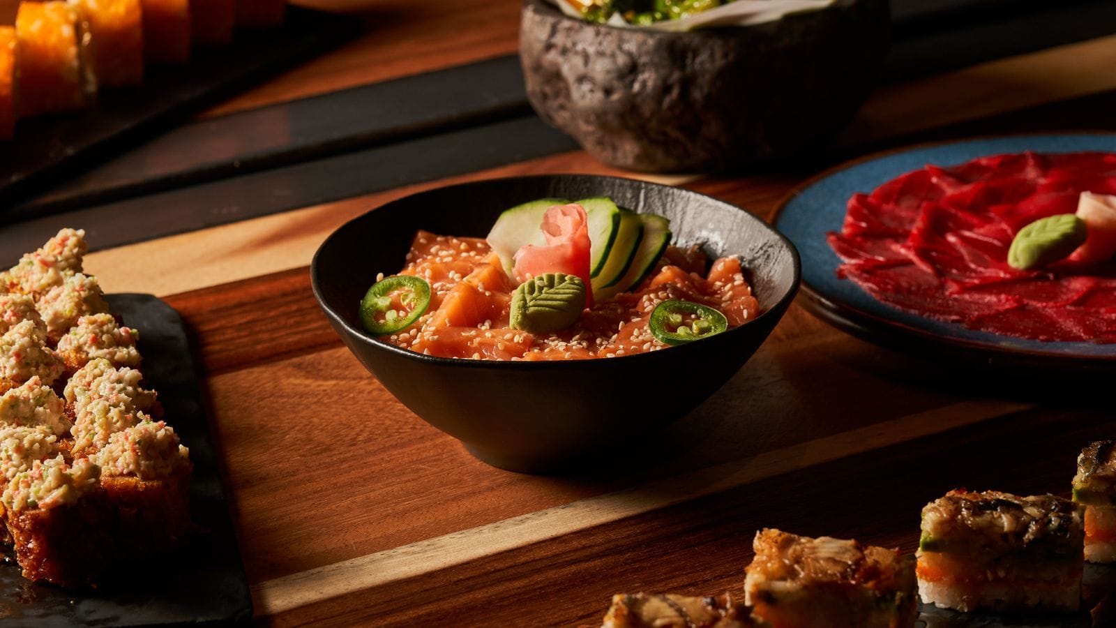 Assorted colorful sushi rolls and Japanese dishes