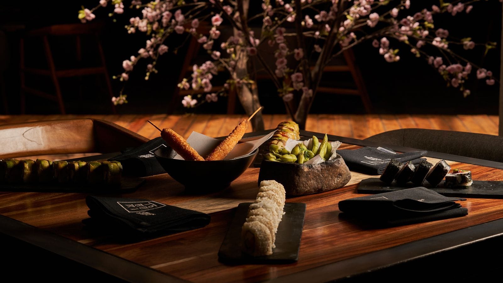Elegant Japanese meal arranged in a warm dining setting